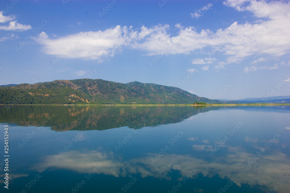 Nature landscape reflection of the sky in the smooth water of the lake Kocegiz, Dalyan Turkey.