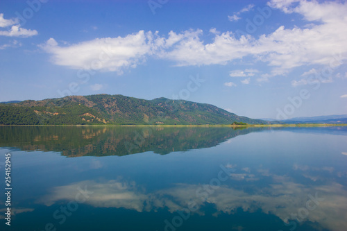 Nature landscape reflection of the sky in the smooth water of the lake Kocegiz, Dalyan Turkey. © margo1778