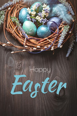 Happy Easter. Congratulatory easter background. Easter eggs and flowers. Selective focus.