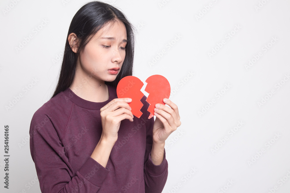 Beautiful young Asian woman with broken heart. Beautiful young Asian woman with broken heart.