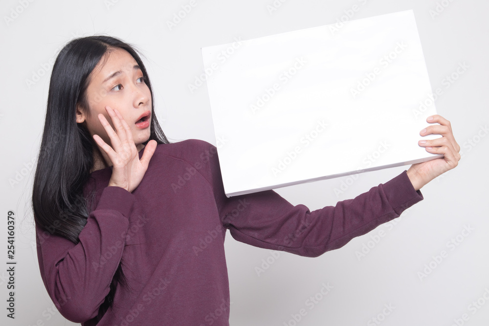 Young Asian woman surprise with white blank sign. Young Asian woman surprise with white blank sign.