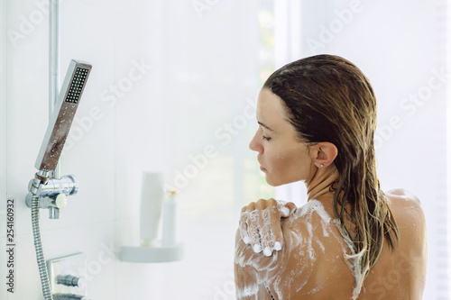 Woman taking bathroom in the morning