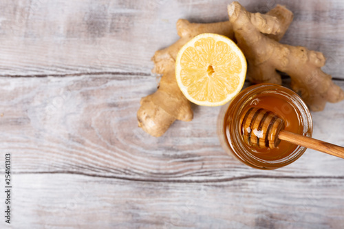 Copy free space. Healthy concept. Lemon, ginger, honey on a white wooden background. Flat lay. Treatment of cold and viruses. Be healthy