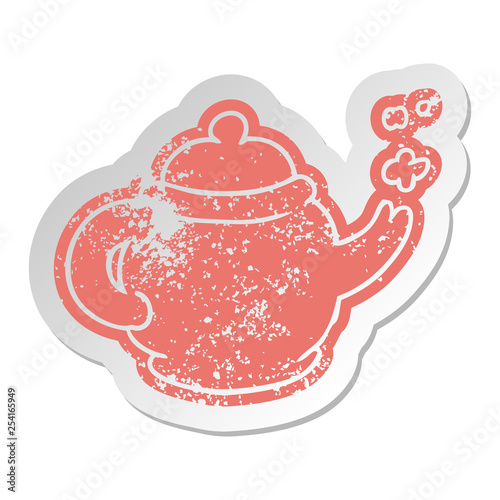 distressed old sticker of a blue tea pot