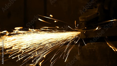 Worker Working With Grinding Tool In The Factory