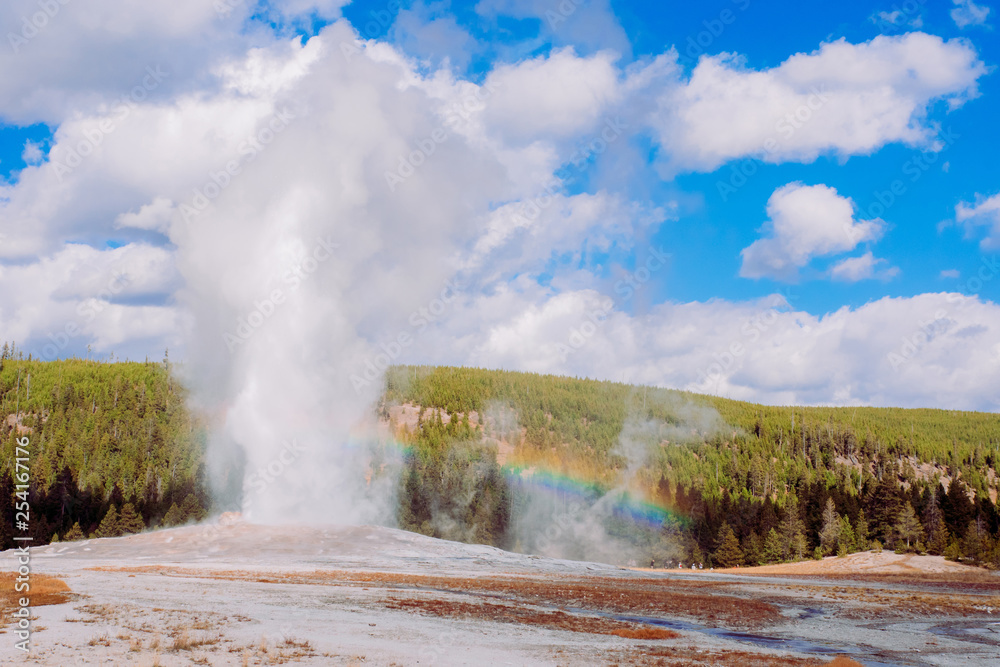 Rainbow in front of Old Faithful Spring