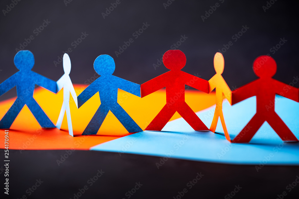 Paper cut concept - multicultural cooperation of the two groups. Orange and blue contrast colors.