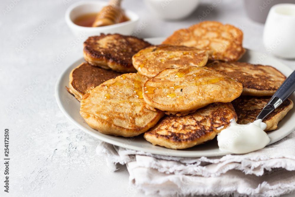 Buckwheat pancakes with honey and sour cream. Breakfast or brunch. Gluten free pancakes.