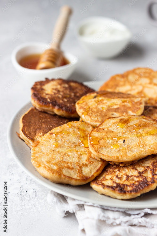 Buckwheat pancakes with honey and sour cream. Breakfast or brunch. Gluten free pancakes.
