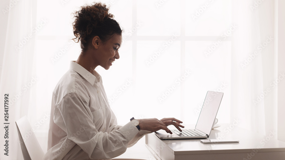 Freelancer working on laptop, typing on keyboard Freelancer working on laptop, typing on keyboard