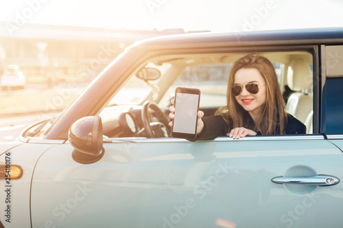 Wallpaper Mural Girl using smartphone with white Blank screen. Torontodigital.ca