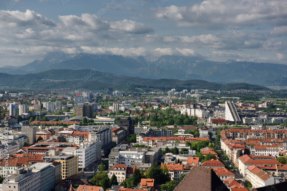 Overview of Ljubljana capital city of Slovenia with Mount Saint Mary and distant Kamnik Savinja Alps mountains from the hilltop Ljubljana Castle