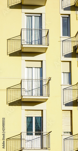 yellow buildings with small balconies