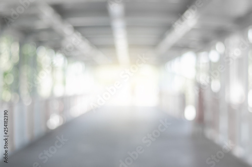Canvas-taulu abstract blurred background outdoor walk way to shopping mall defocused depth white bokeh with customer walking in to hall of department store