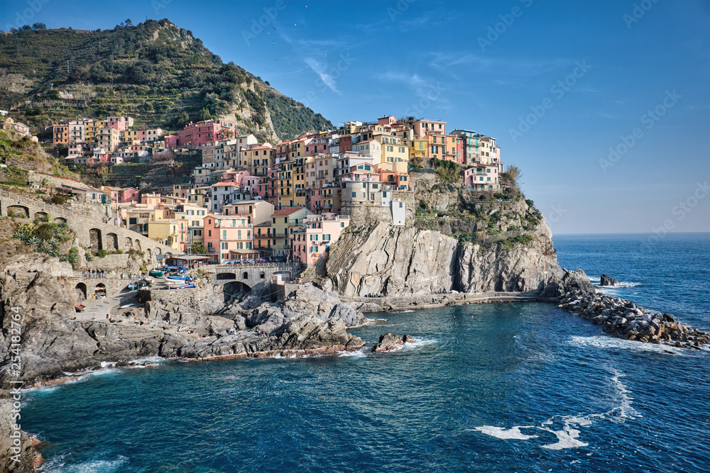 View of the colourful fishing village of Manarola from the cliff in Liguria, Italy.