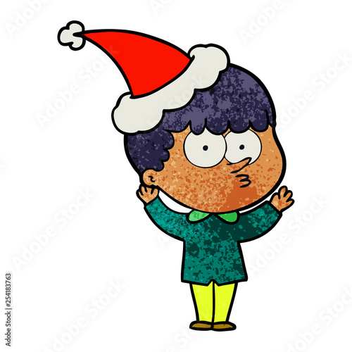 textured cartoon of a curious boy wearing santa hat © lineartestpilot