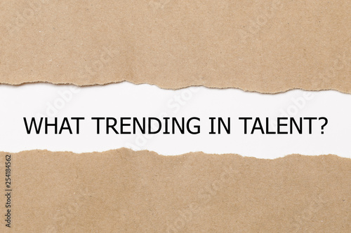 WHAT TRENDING IN TALENT? question written under torn paper. - Image 
