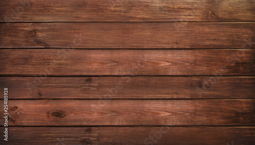 Brown wooden plank desk table background texture. Top view