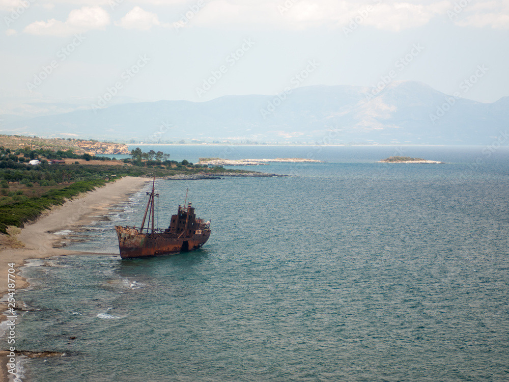 Rusty ship washed ashore off the coast of Greece