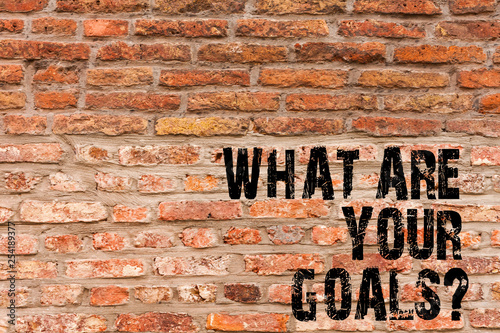 Handwriting text writing What Are Your Goalsquestion. Conceptual photo asking someone about his life targets Brick Wall art like Graffiti motivational call written on the wall