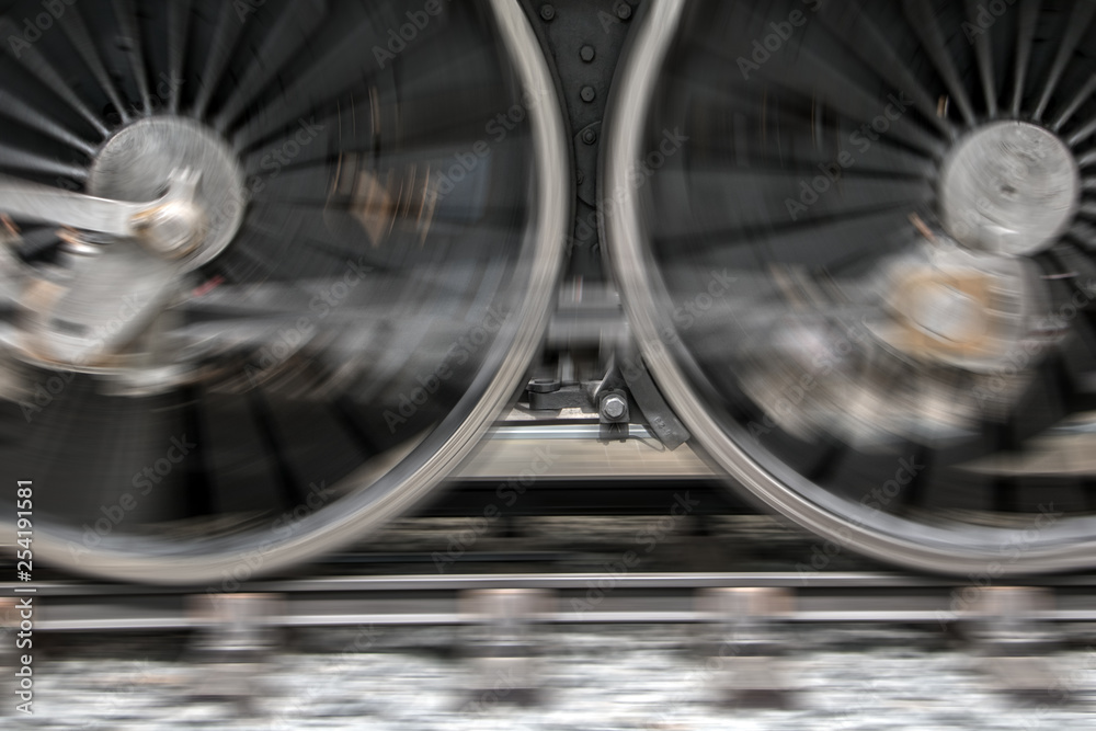 The rotating wheels of steam locomotive on railroad. Detail of steam ...