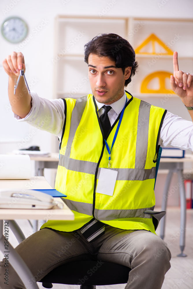Male construction engineer working in the office Male construction engineer working in the office