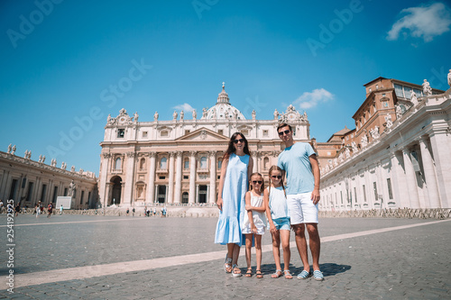 Happy family at St. Peter's Basilica church in Vatican city.
