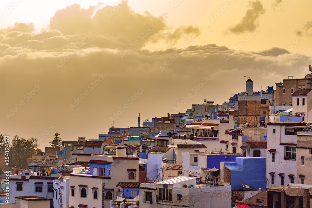 Blue and White Colored Homes and Buildings in Chefchaouen Morocco during a Golden Sunset