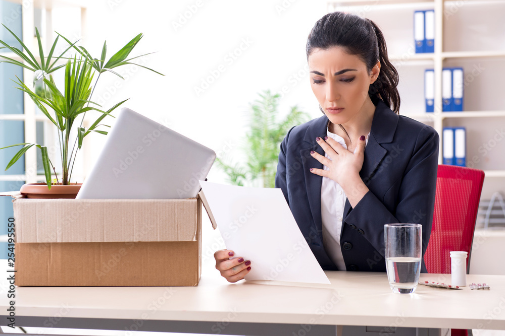 Young female employee being fired from her work Young female employee being fired from her work