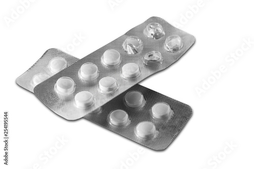 Two blisters with pills. One blister is already unpacked.