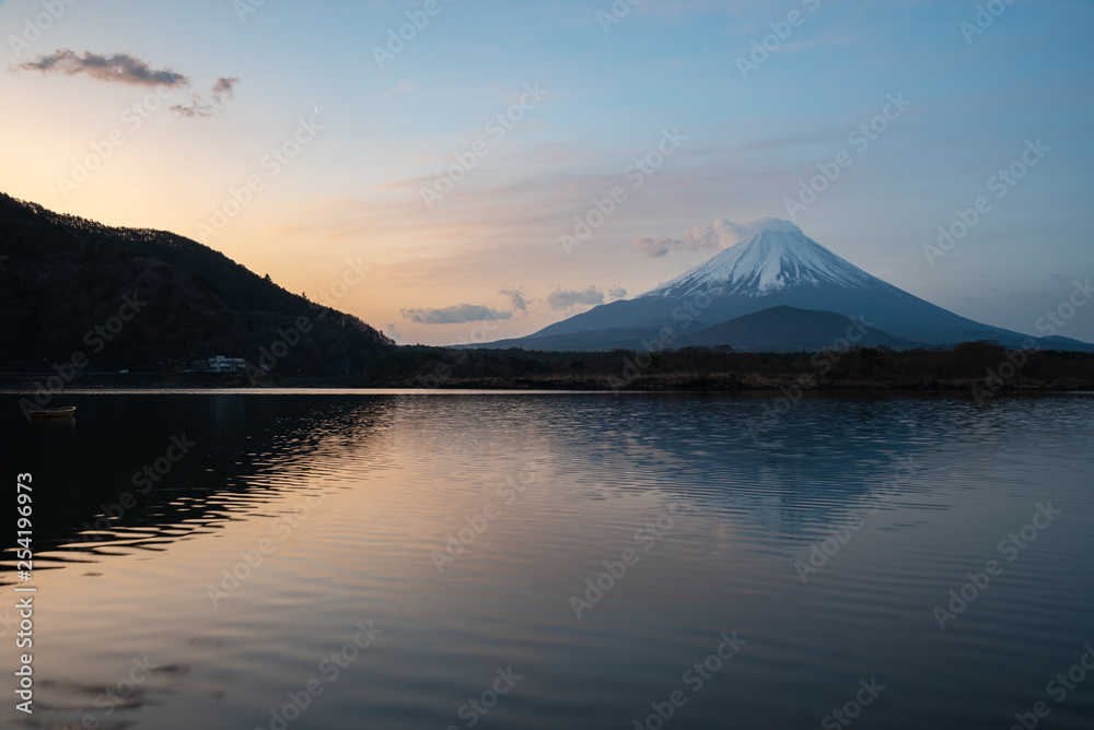 Mount Fuji, the World Heritage, view at Lake Shoji ( Shojiko ) in the morning. Mt. Fuji reflection on sunrise. Fuji Five Lake region, Yamanashi prefecture, Japan. Landscape for travel destination.