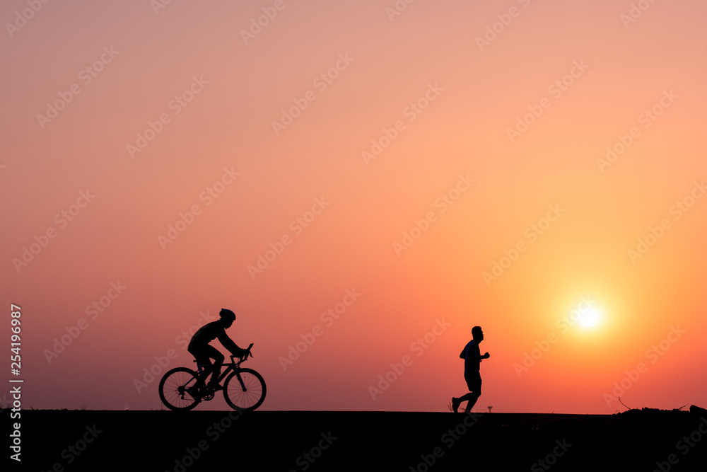 ride a bicycle ,silhouette background.