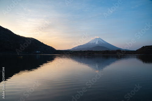 Mount Fuji, the World Heritage, view at Lake Shoji ( Shojiko ) in the morning. Mt. Fuji reflection on sunrise. Fuji Five Lake region, Yamanashi prefecture, Japan. Landscape for travel destination.