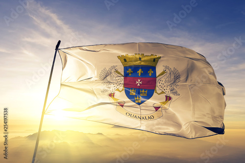 Collectivity of Saint-Barthelemy of France flag waving on the top mist fog