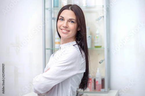 A portrait of a woman cosmetologist in a spa center photo