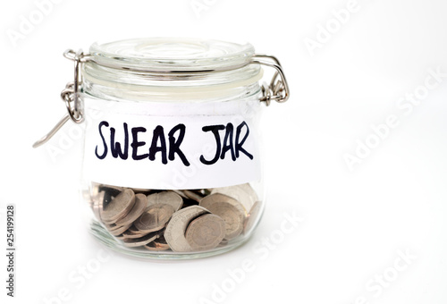Swear jar with coins on white background