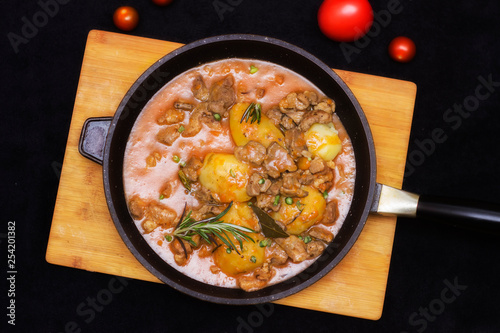 Meat stewed with vegetables in tomato sauce (hungarian goulash) close up