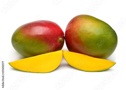 Two mango fruit whole and slice isolated on a white background. Flat lay, top view