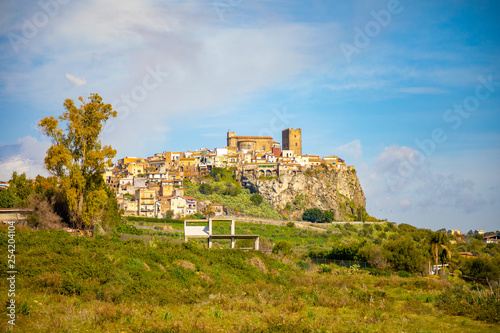 View of rock castle, abbey and village of Motta Santa Anastasia, Sicily, Italy