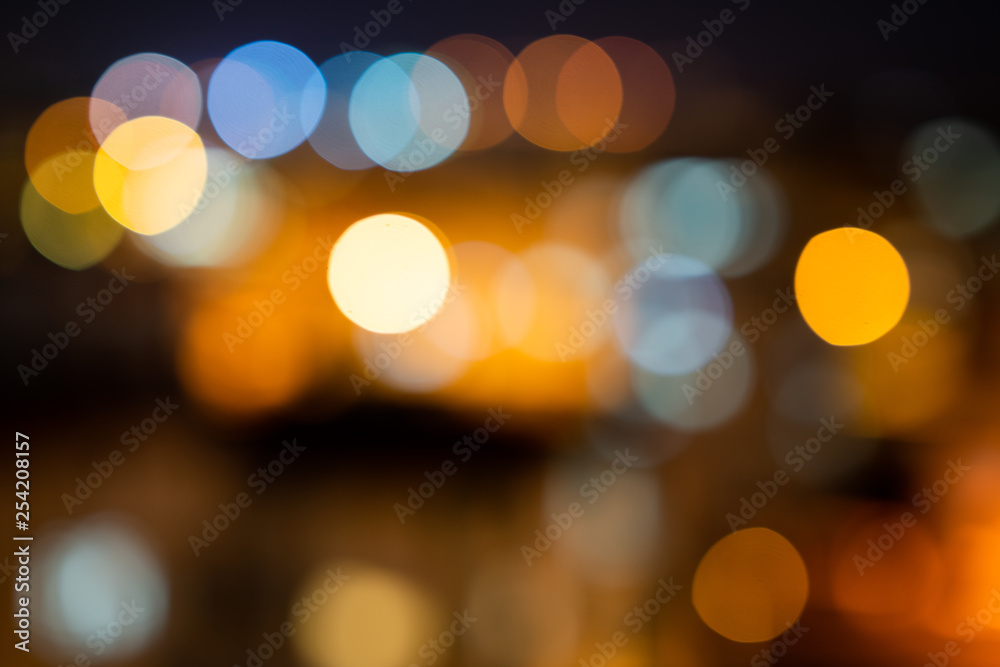 Colorful defocused bokeh lights in blur night background Colorful defocused bokeh lights in blur night background