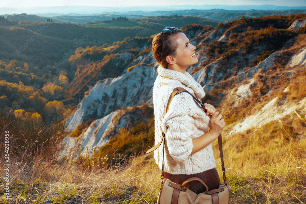 tourist woman on summer hiking in Tuscany enjoying promenade tourist woman on summer hiking in Tuscany enjoying promenade
