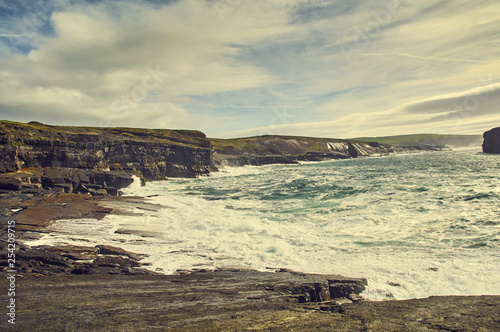 Sunny Cliffs of Kilkee in Ireland county Clare. Tourist destination