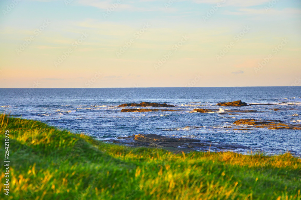 Sunny Cliffs of Kilkee in Ireland county Clare Sunset. Tourist destination Sunny Cliffs of Kilkee in Ireland county Clare Sunset. Tourist destination