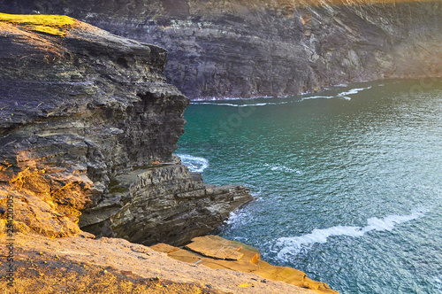 Sunny Cliffs of Kilkee in Ireland county Clare. Tourist destination