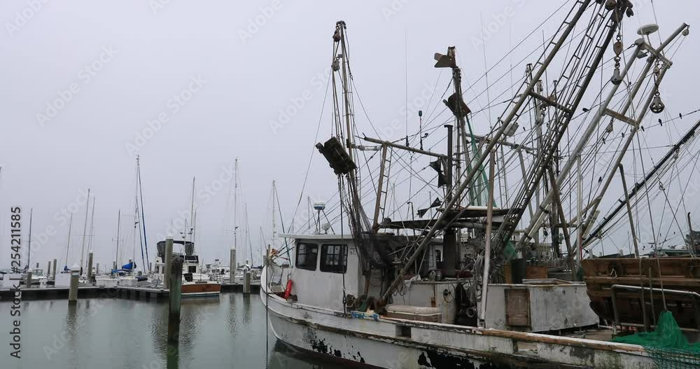 Fishing trawler boats harbor Corpus Christi Texas. South Texas tourism travel destination. Waterfront marina, port harbor and scenic byway. Year round vacation city. Fishing trawler boats harbor Corpus Christi Texas. South Texas tourism travel destination. Waterfront marina, port harbor and scenic byway. Year round vacation city.