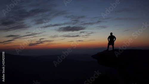 Hiker approaches McAfee Knob at sunrise photo