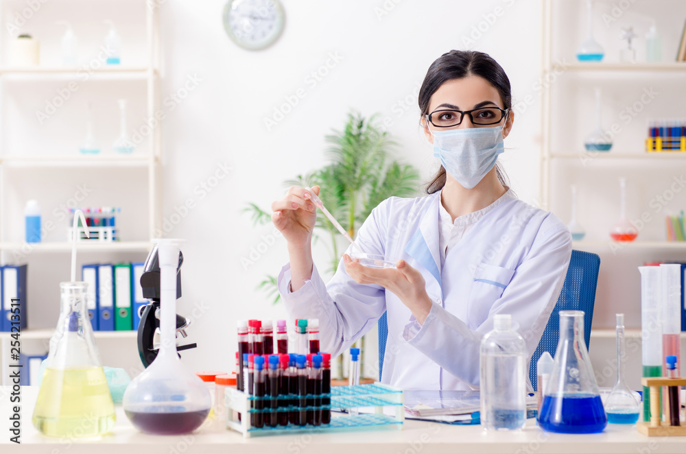 Young female chemist working in the lab Young female chemist working in the lab