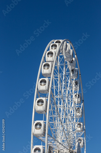 white ferris wheel on blue background