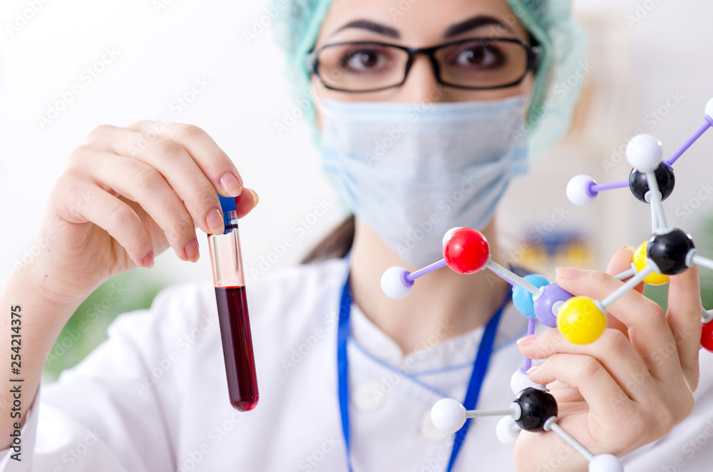 Young female chemist working in the lab Young female chemist working in the lab