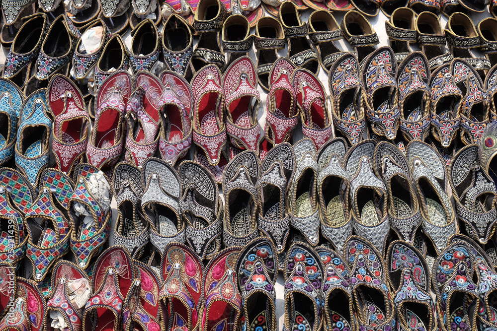 Display of traditional shoes at the street market in Jaipur, India